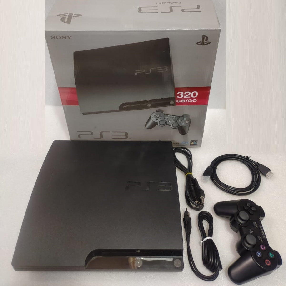 Pre-owned Sony PlayStation 3 Slim 500gb HDD with 2 remotes - Preloaded around 30 games